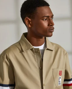 Blusão de algodão com pormenor de riscas e bolso no peito