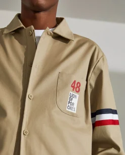 Blusão de algodão com pormenor de riscas e bolso no peito