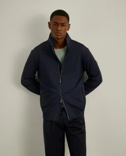 Blusão em tecido técnico com capuz embutido