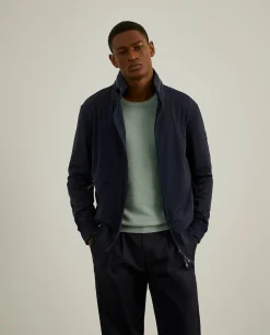 Blusão em tecido técnico com capuz embutido