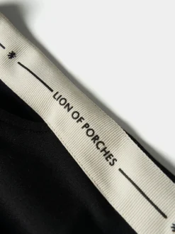 Calças de malha com risca lateral