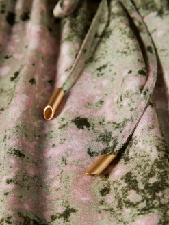 Calças de perna larga com padrão abstrato