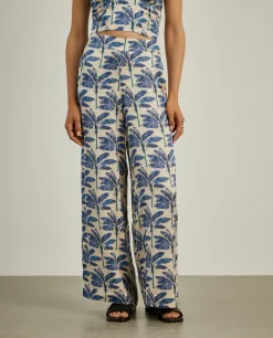 Calças pantalona com padrão de palmeiras