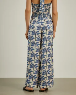 Calças pantalona com padrão de palmeiras