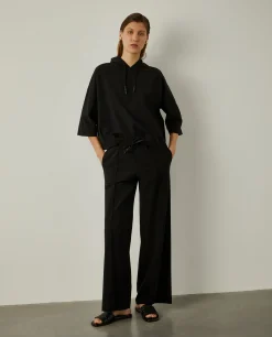 Calças pantalona em malha cintura ajustável