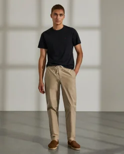 Calças regular fit de algodão com cordão