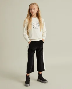 Calças veludo bicolor