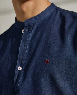 Camisa slim fit denim com carcela de polo