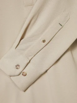 Camisa slim fit em malha piqué com carcela de polo