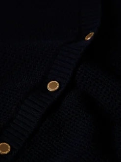 Casaco de malha com botões em contraste