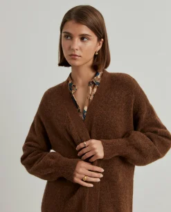 Casaco de malha comprido mangas abalonadas