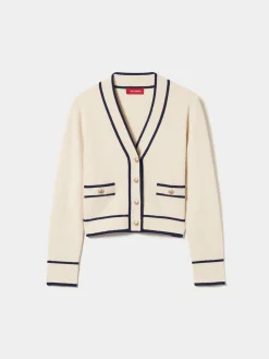 Casaco malha com riscas e botões brasão