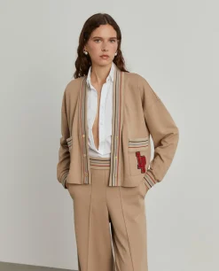 Casaco malha às riscas com bolsos