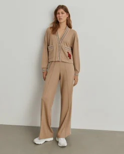 Casaco malha às riscas com bolsos