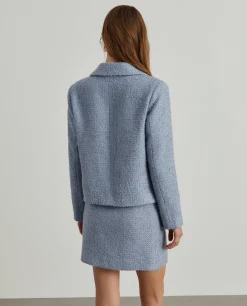 Casaco tweed cruzado com bolsos