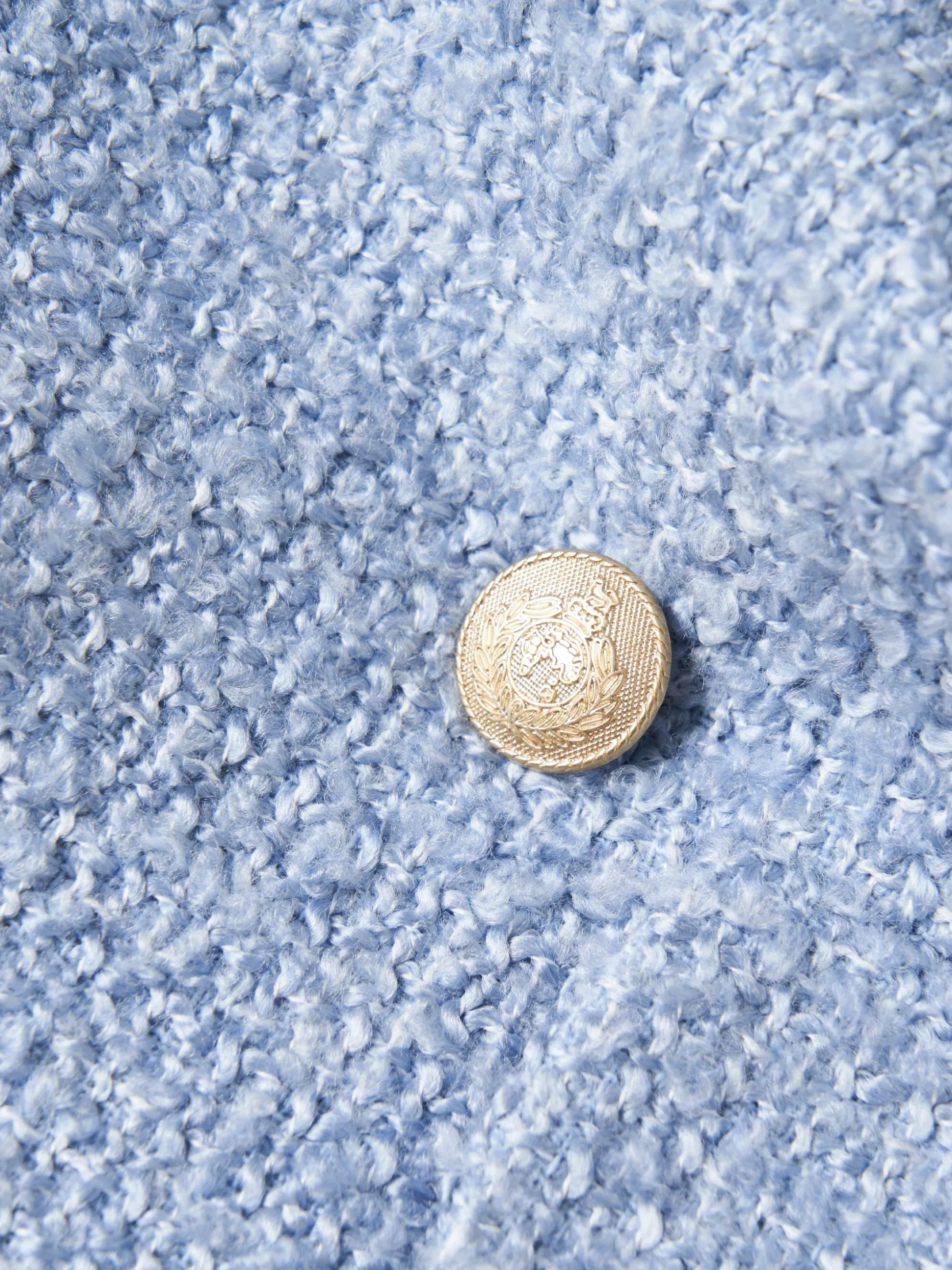 Casaco tweed cruzado com bolsos