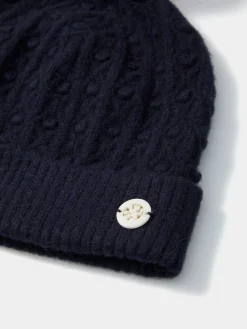 Gorro em malha tricotada com pompom