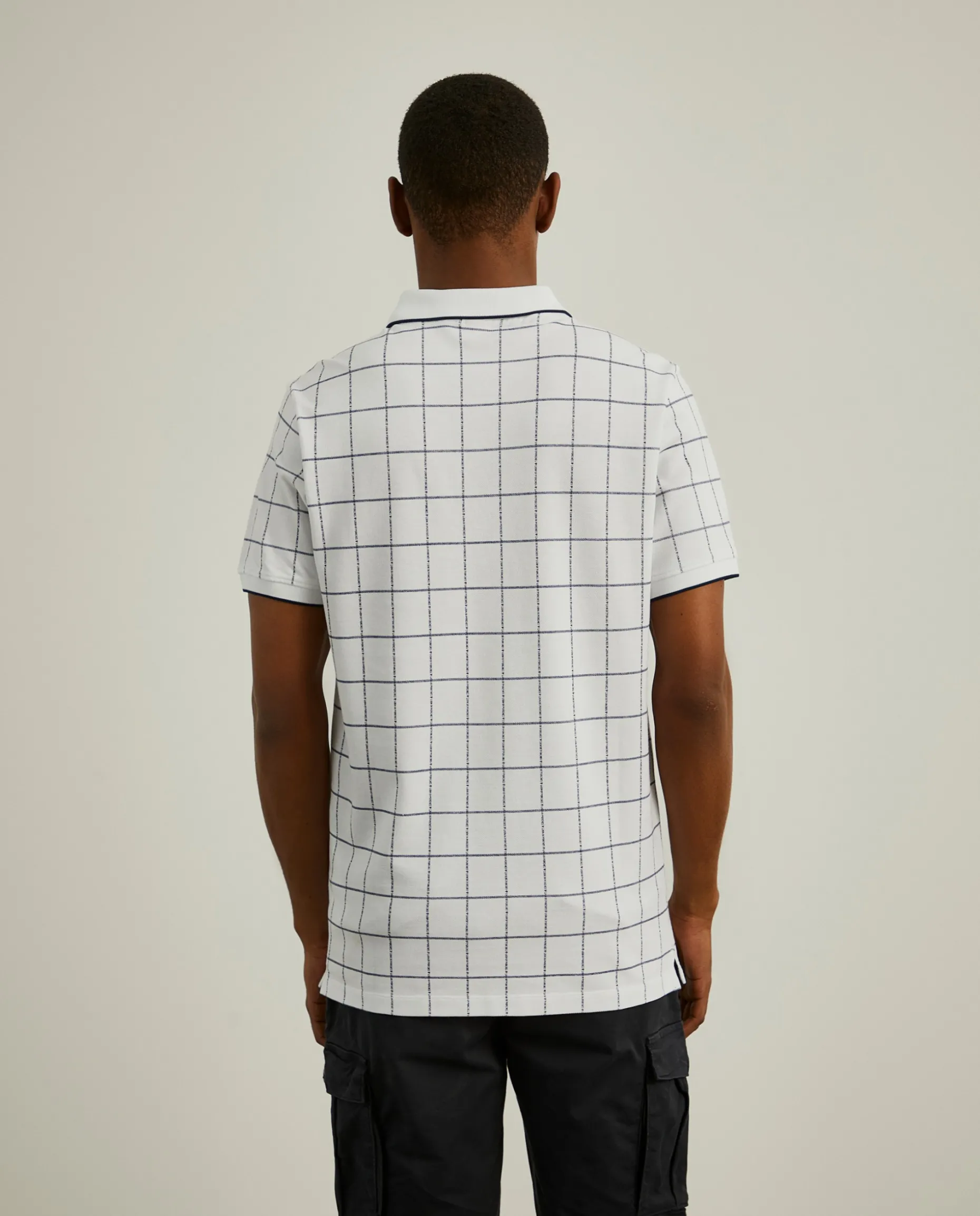 Polo slim fit com padrão quadrados