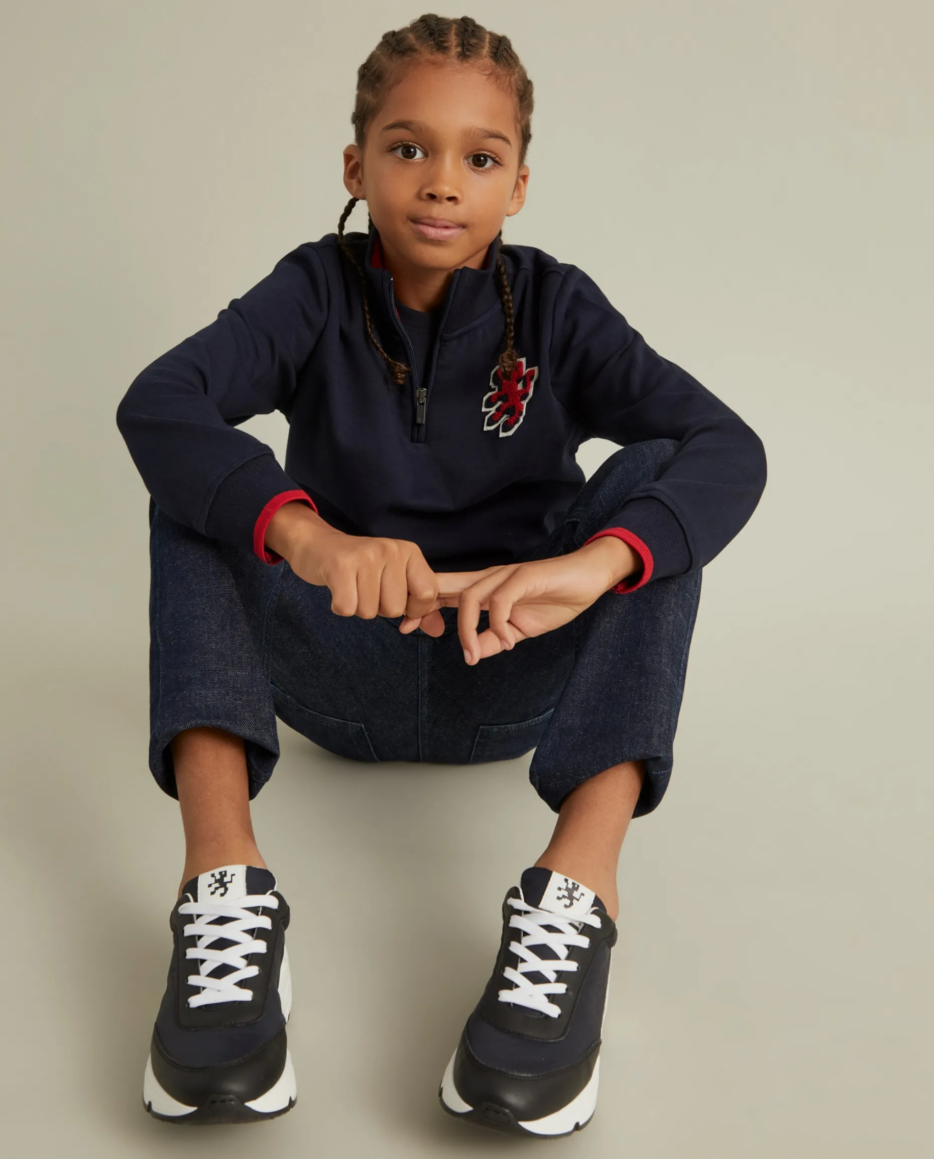 Sweater com fecho e riscas em contraste